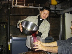 Fr Philip pouring wine.jpg
